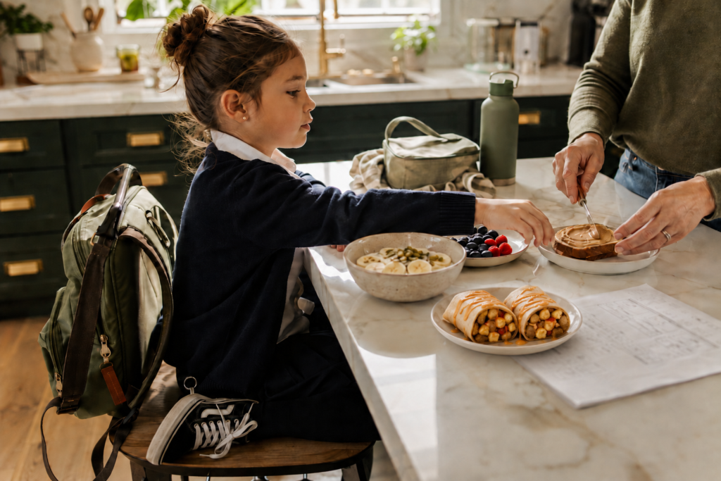 featured image easy breakfast Easy vegan breakfast for kids with oatmeal, berries, toast, and a sauced breakfast burrito during a busy school morning.