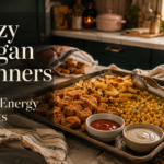 One-pan lazy vegan dinner with crispy plant-based nuggets, seasoned fries, buttery black-pepper corn, and dipping sauces on a sheet pan.